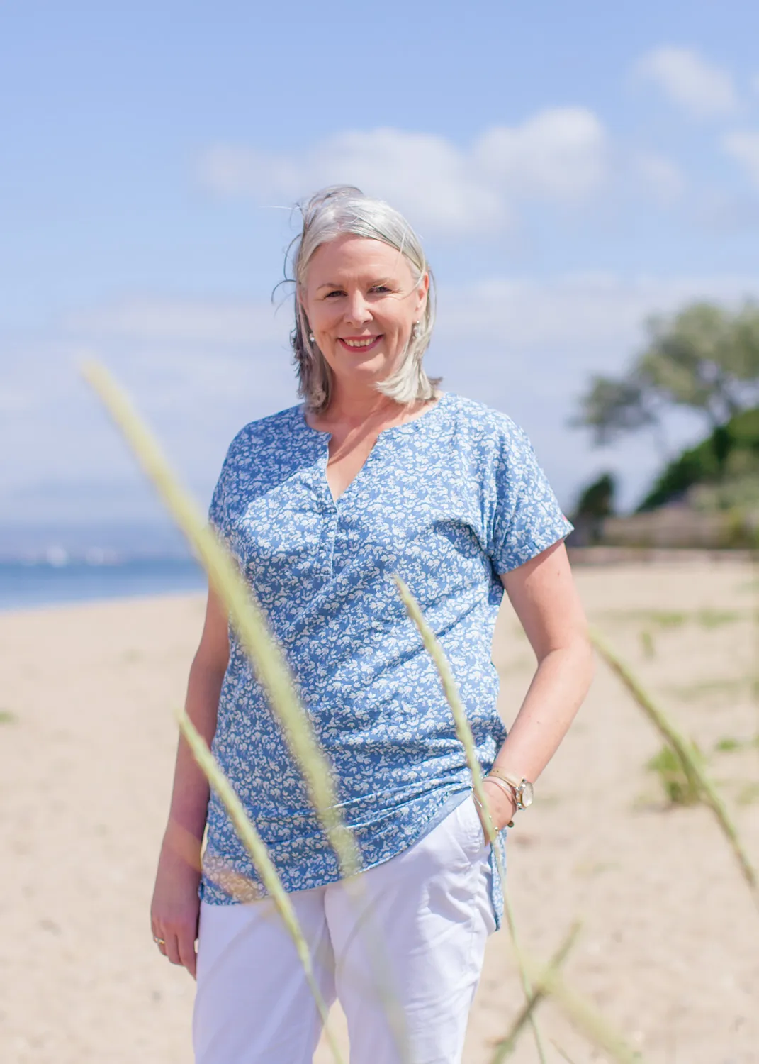 Nichola Lynagh standing on a beach on a bright day
