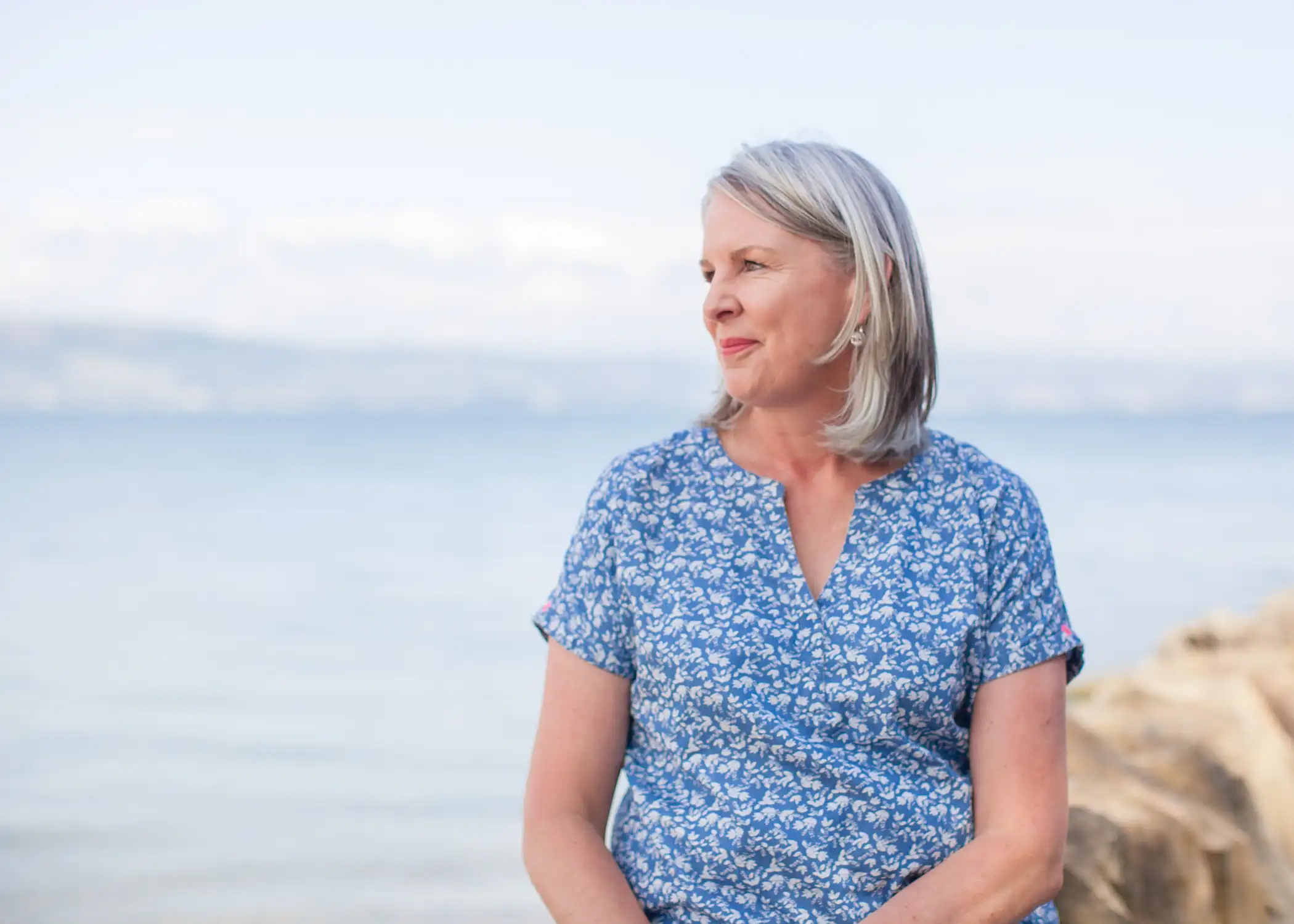 Nichola Lynagh looking out across the water on the Northern Irish coast