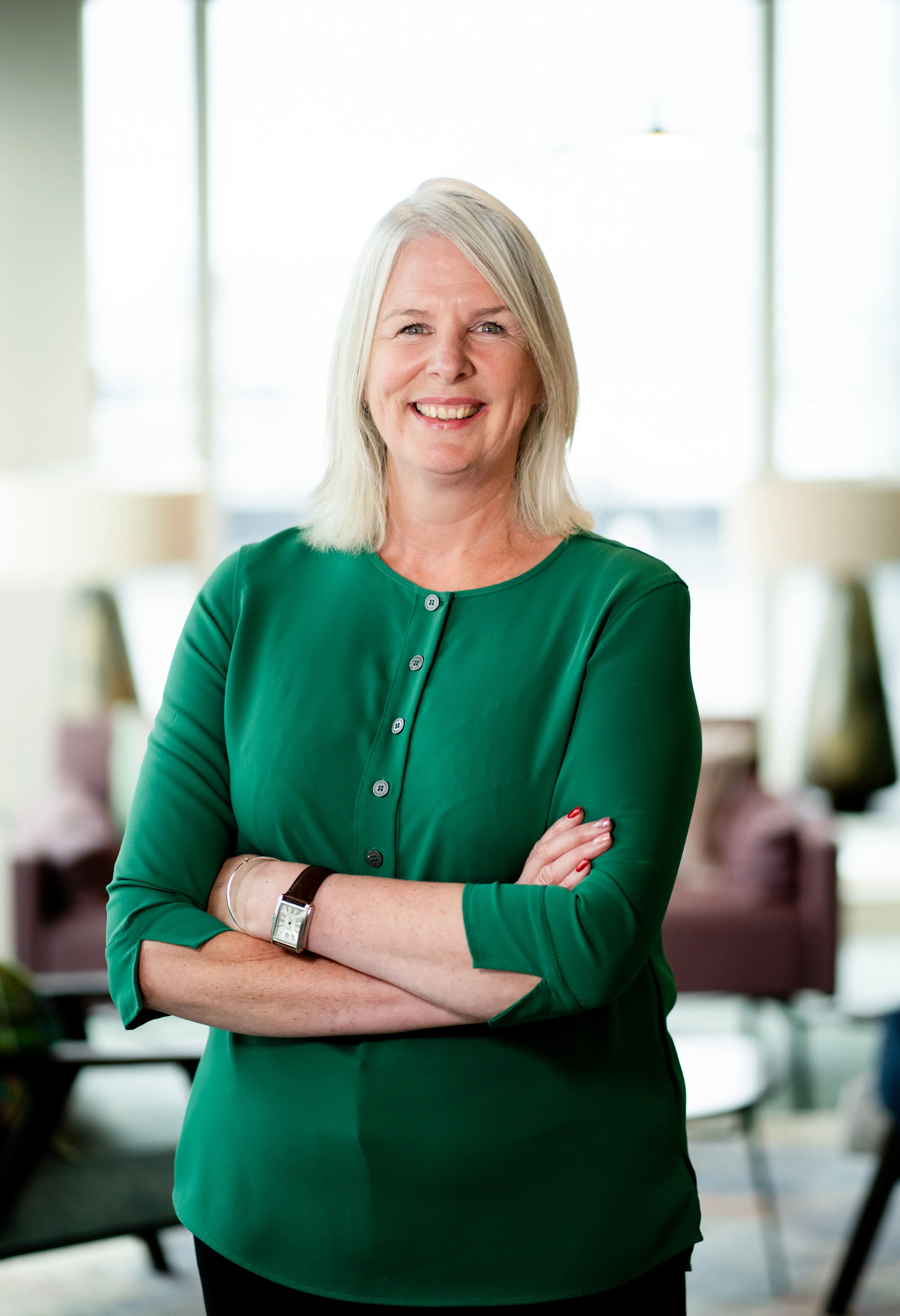 Nichola Lynagh standing in a bright Belfast office